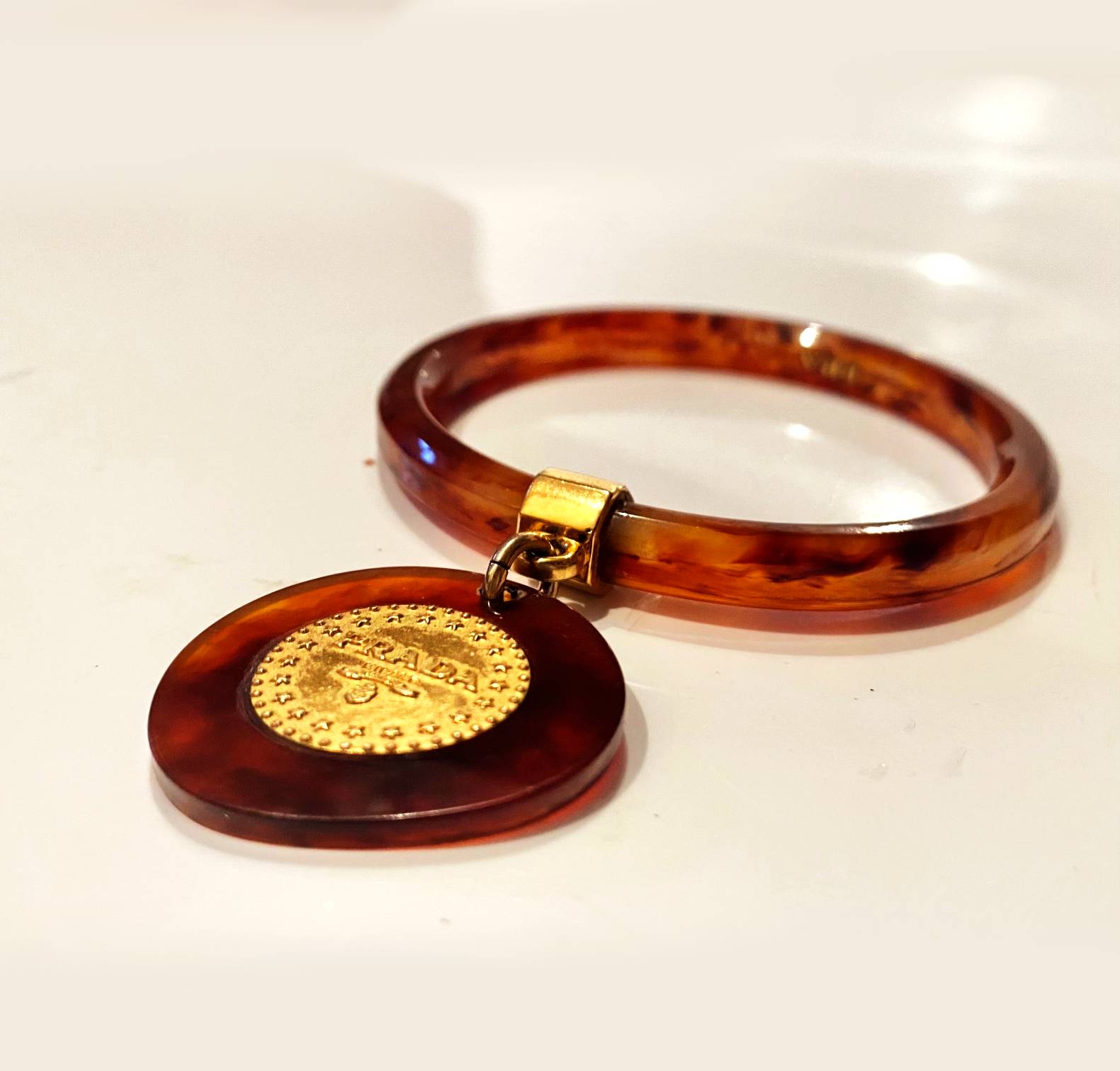 1990s Prada Resin Brown Bangle with Hanging Gold Metal Medallion - STYLE - CHNGR